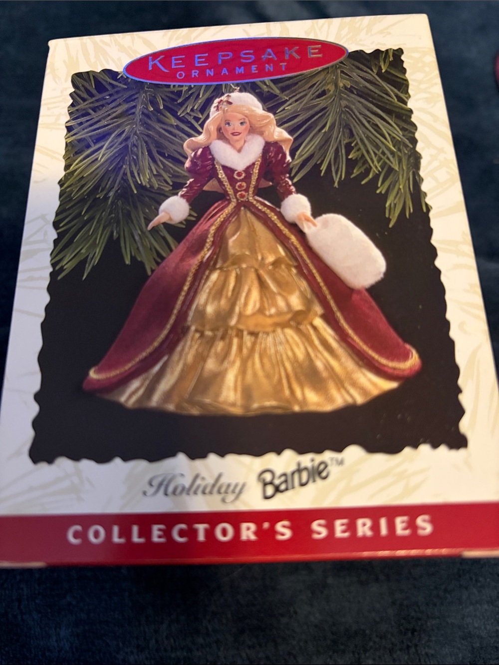 Hallmark Barbie Holiday Ornament in Red and Gold with White Trim.